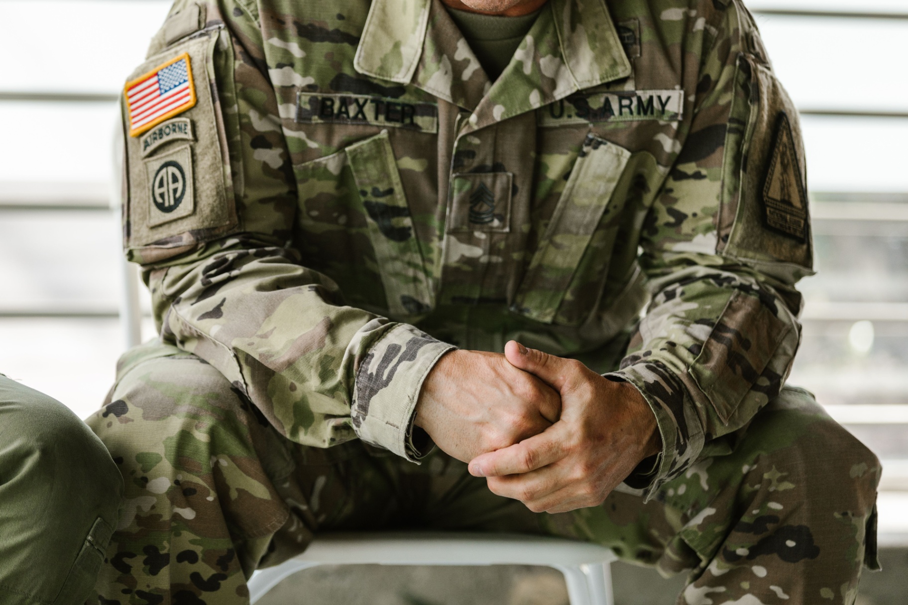 Veteran's hands folded quietly